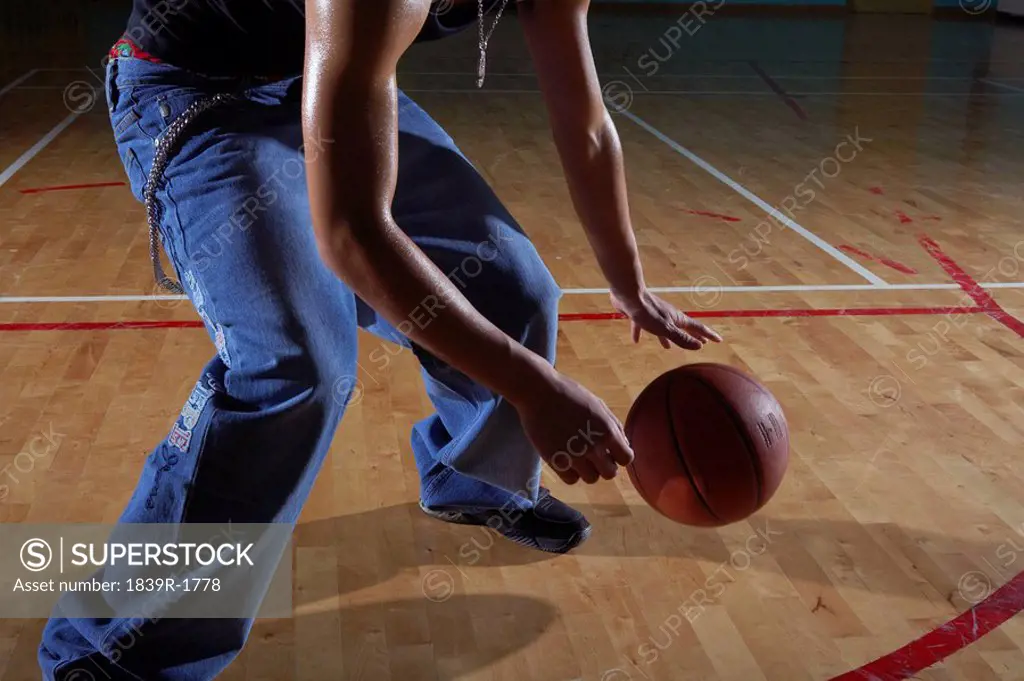 Man Playing Basketball On Court