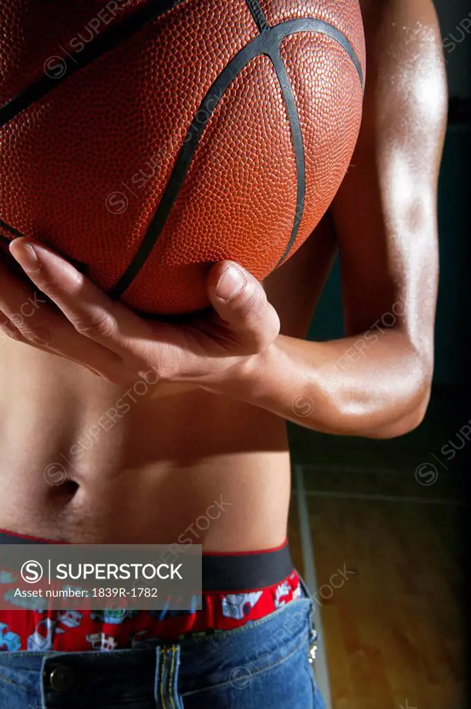 Topless Man Holding Basketball