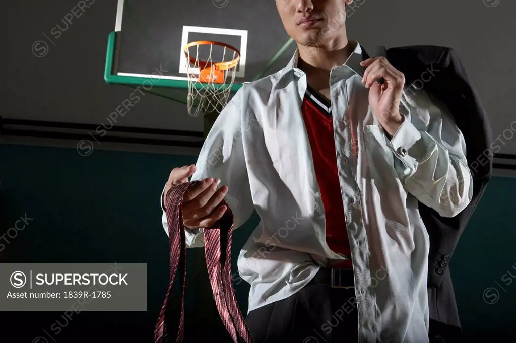 Disheveled Looking Business Man On Basketball Court