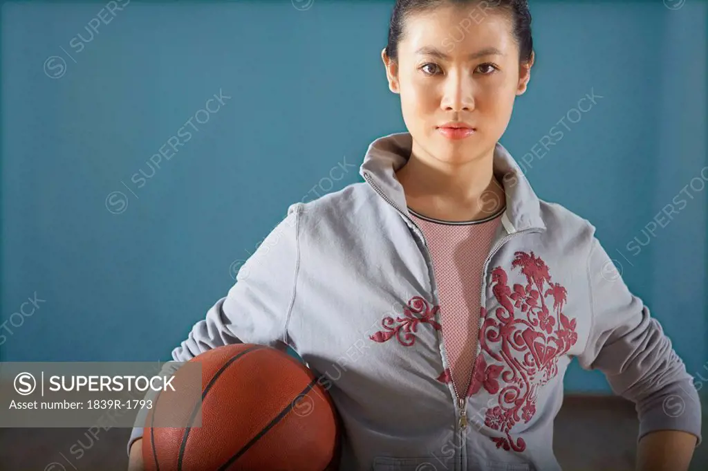 Teenage Girl Holding Basketball