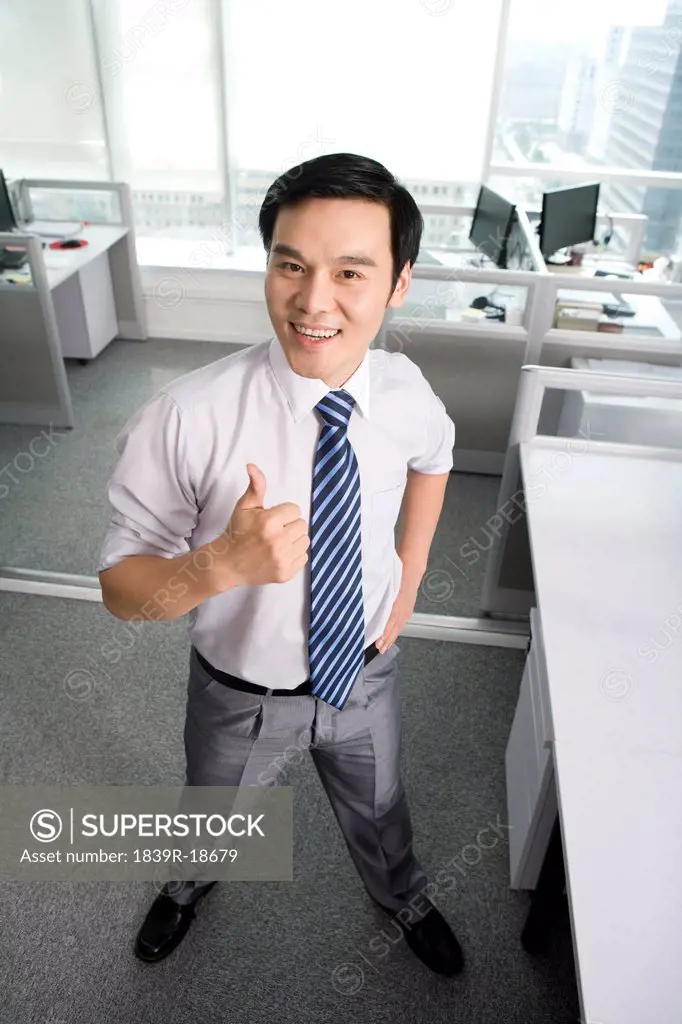 Office worker giving thumbs up