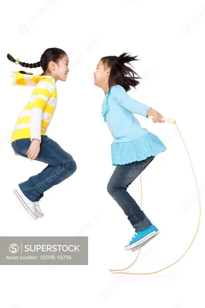 Two friends jump roping together