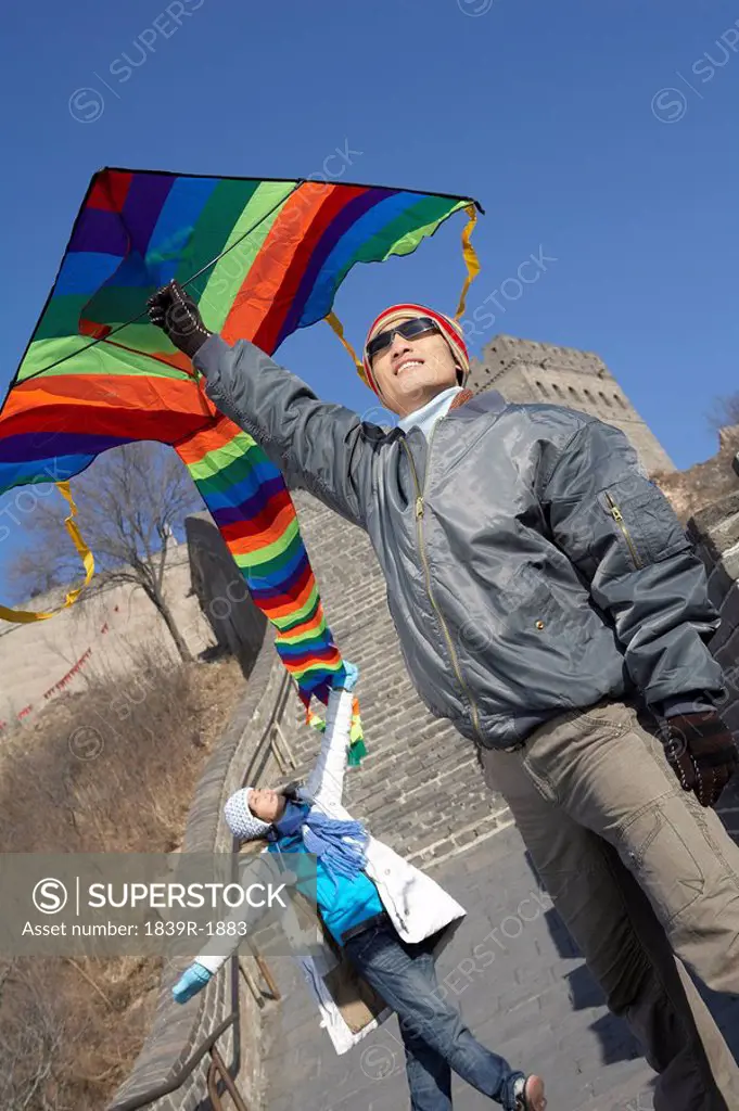 Young Couple On The Great Wall Of China With A Kite