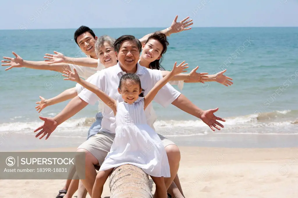 Happy Family Posing at the Beach