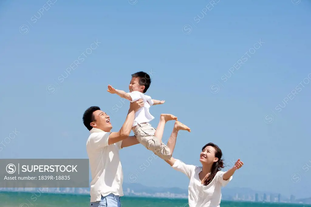 Family Playing at the Beach