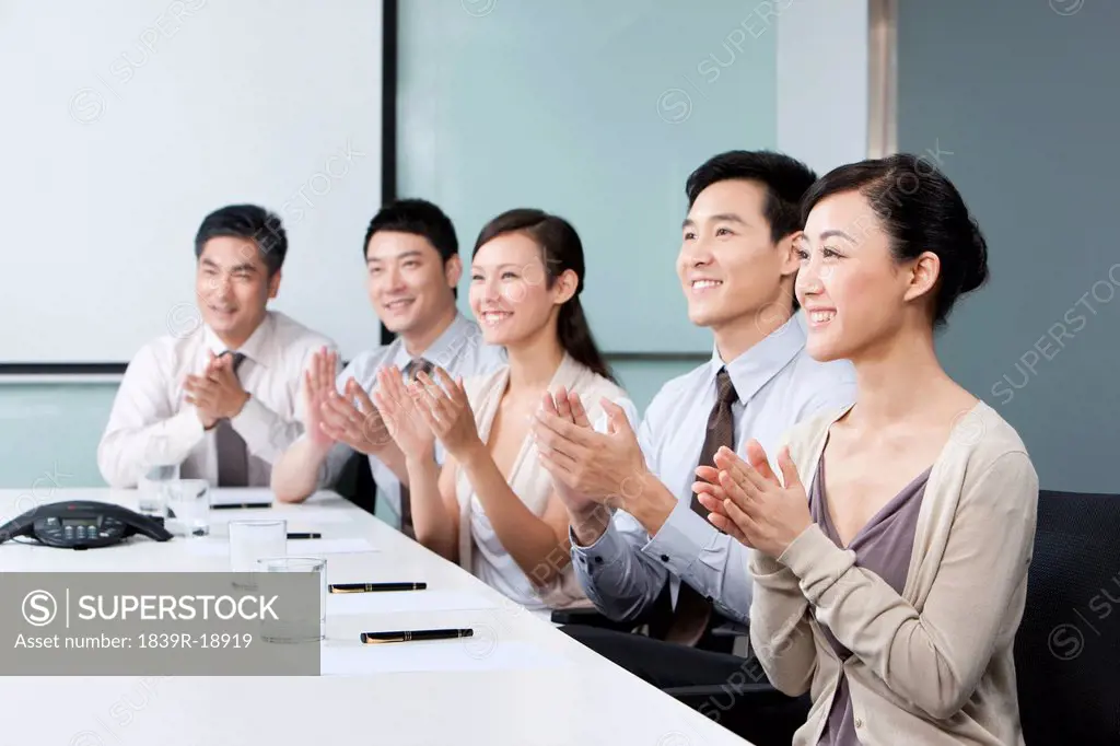 Business Team Applauding Success