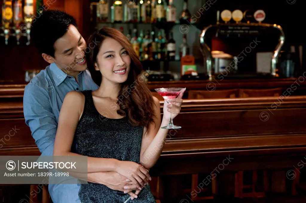 Couple Enjoying Cocktails Together