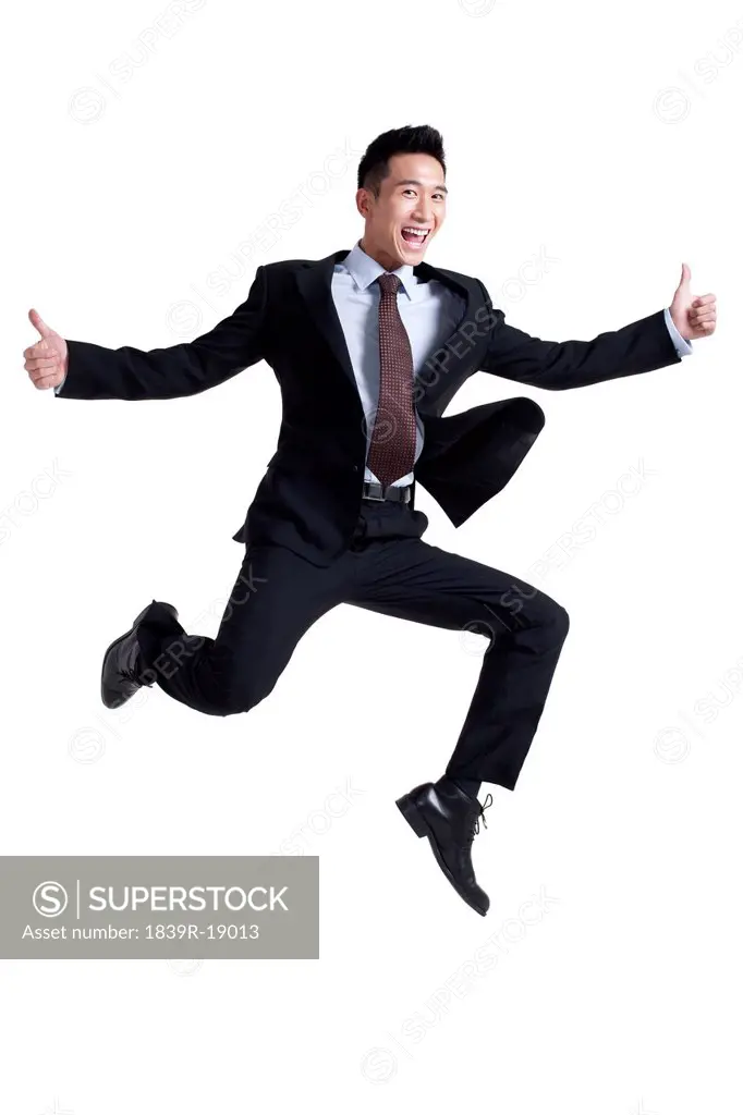 Portrait of an Excited Businessman Jumping Up