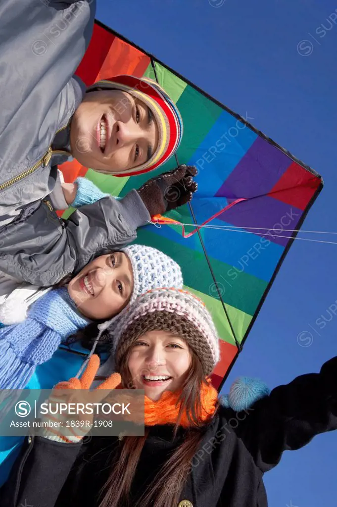 Young People Flying A Kite On The Great Wall Of China