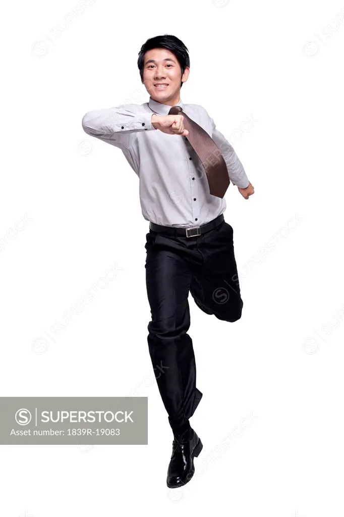 Excited Businessman Jumping in the Air