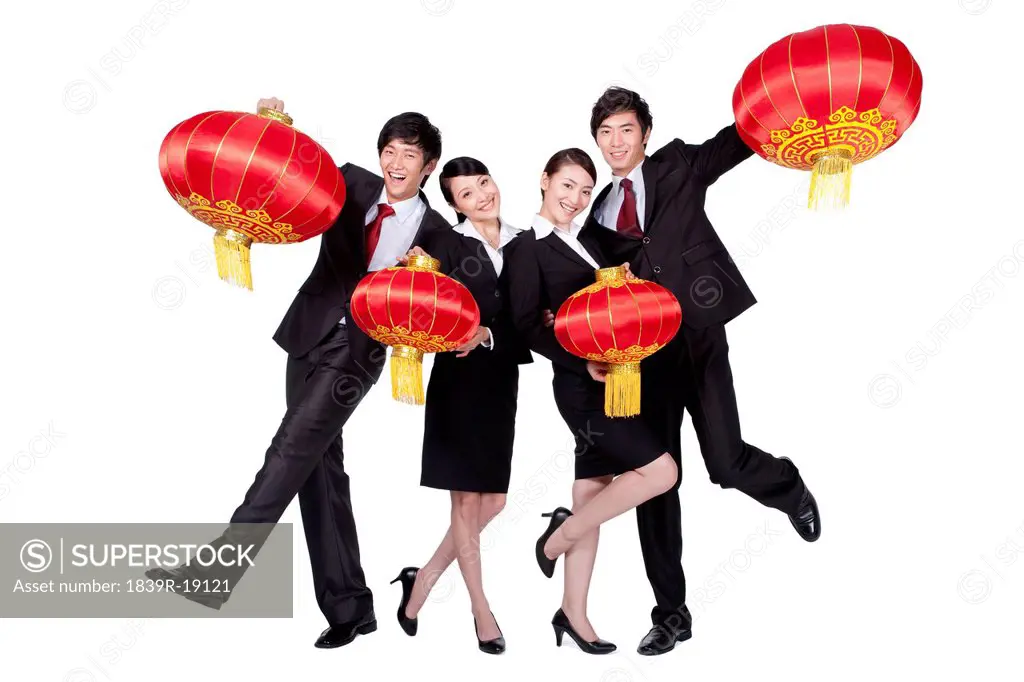 Business Colleagues Holding Up Chinese Lanterns