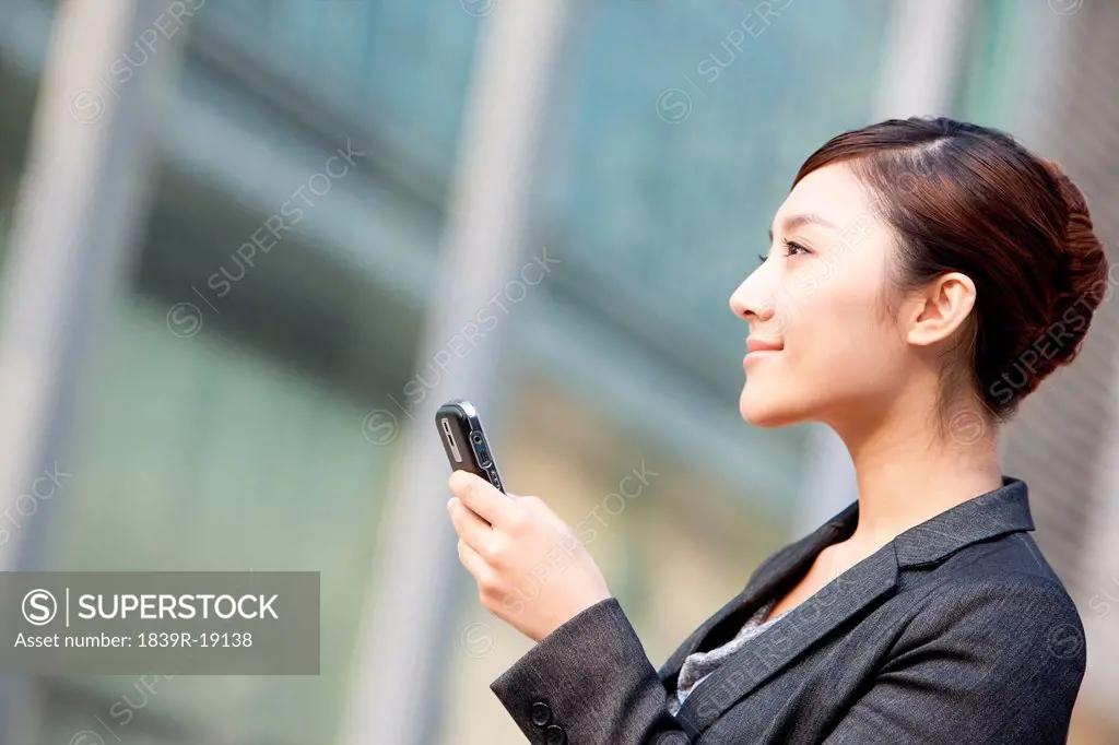 Chinese businesswoman with cellphone