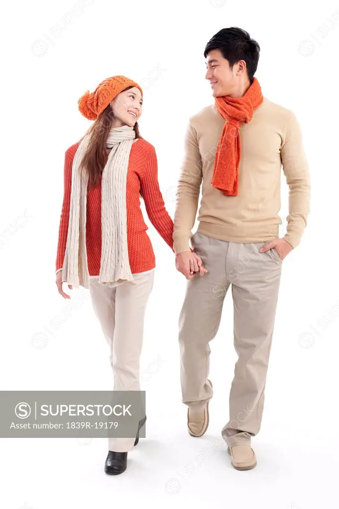 Young affectionate couple walking