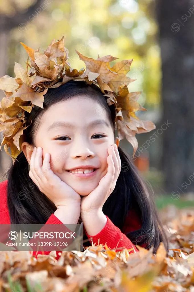 Girl with a crown of Autumn leaves