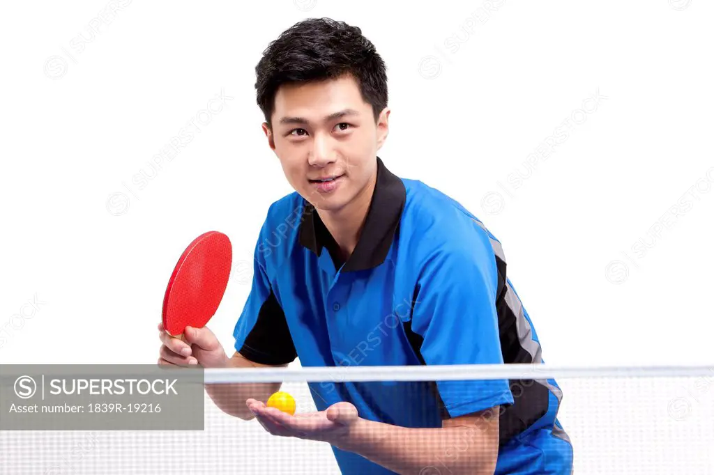 Table tennis player ready to serve