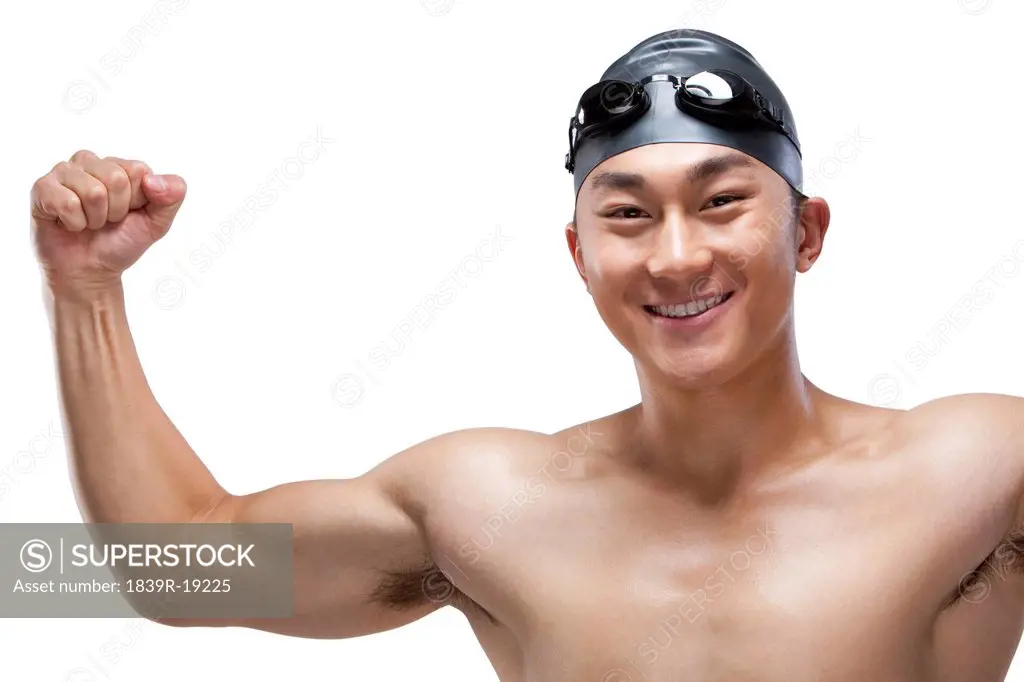 Swimmer flexing his muscles