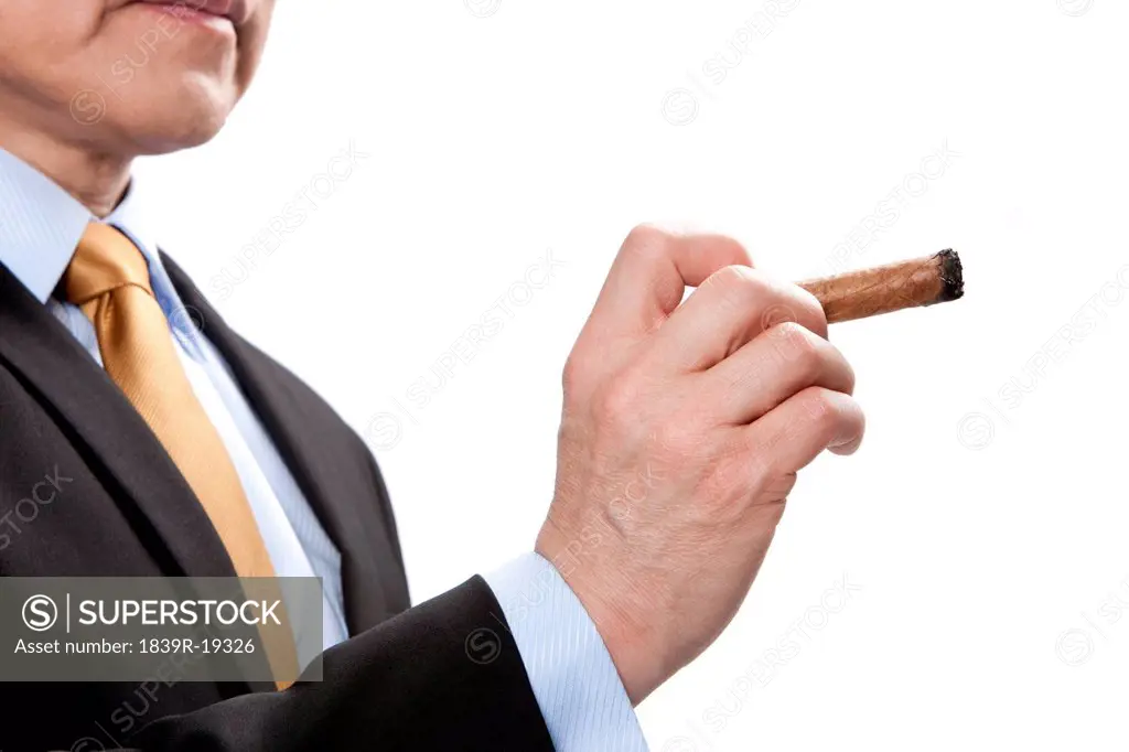 Businessman holding a cigar