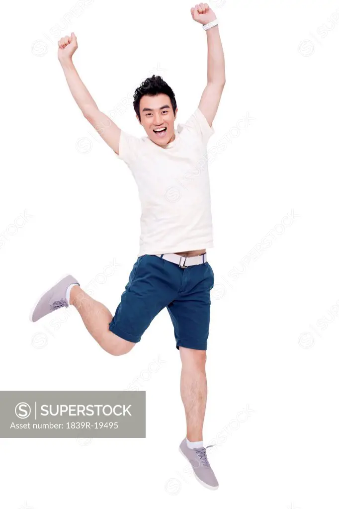 Cheerful young man jumping