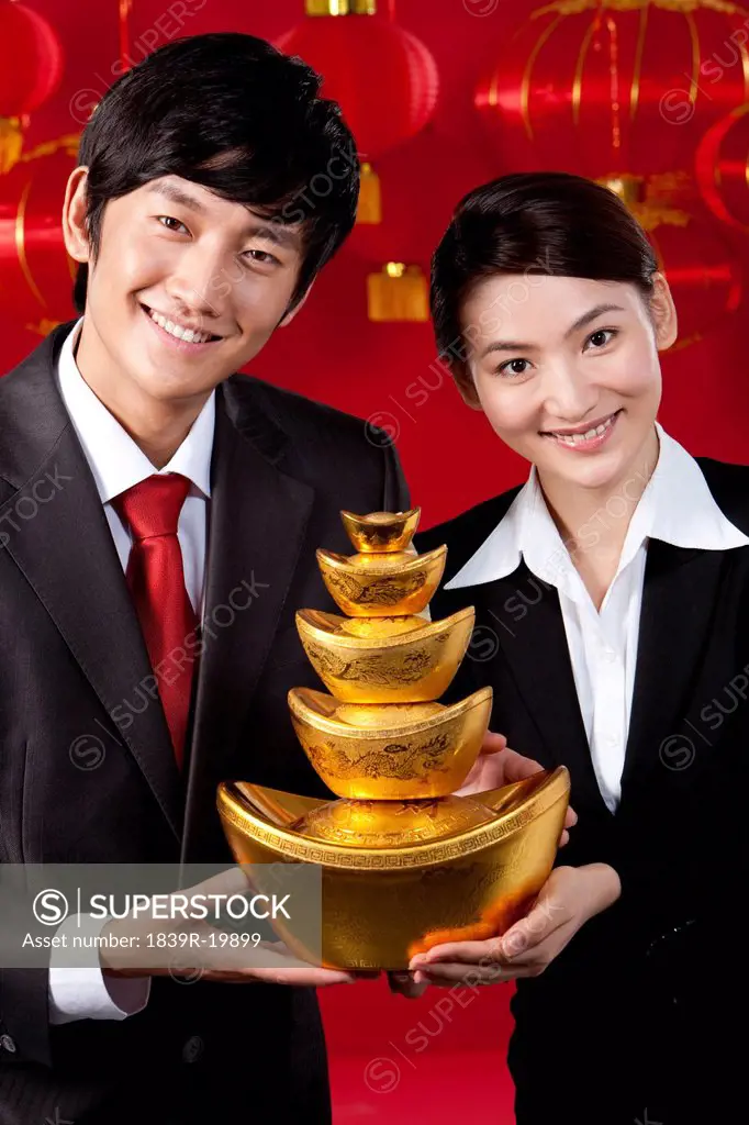 Businessmen Holding Chinese Gold Yuanbao