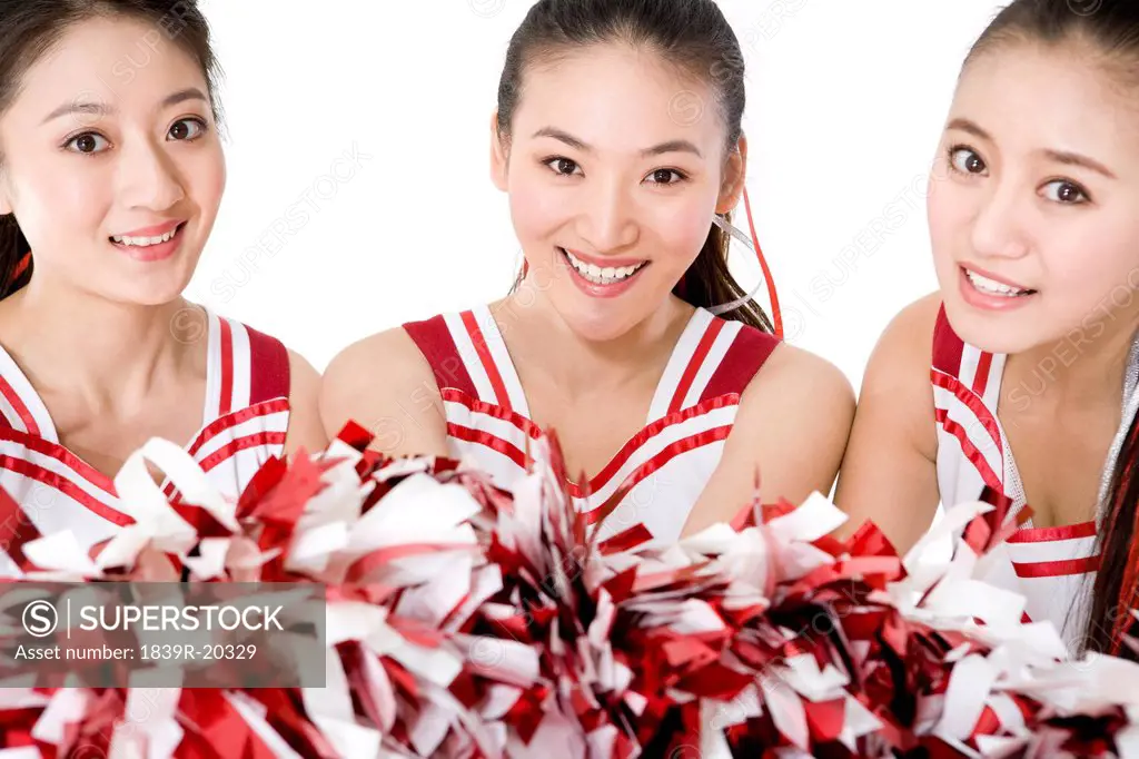 Portrait of three cheerleaders