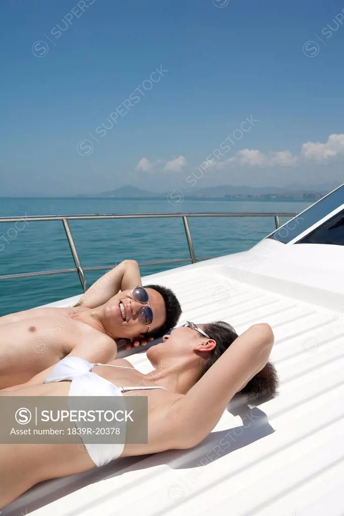 Man and Woman Relaxing on a Yacht