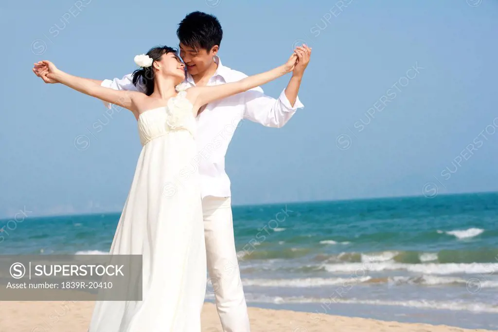 Happy Newlyweds on the Beach