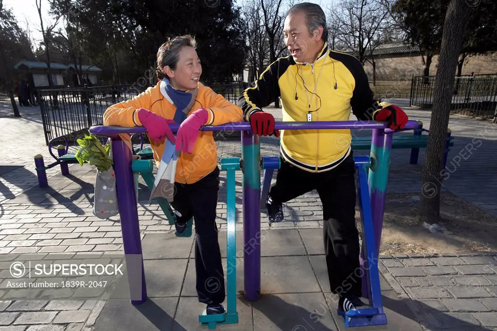 Elderly Couple Exercising Outdoors