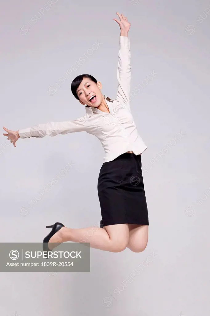 Excited Businesswoman Jumping