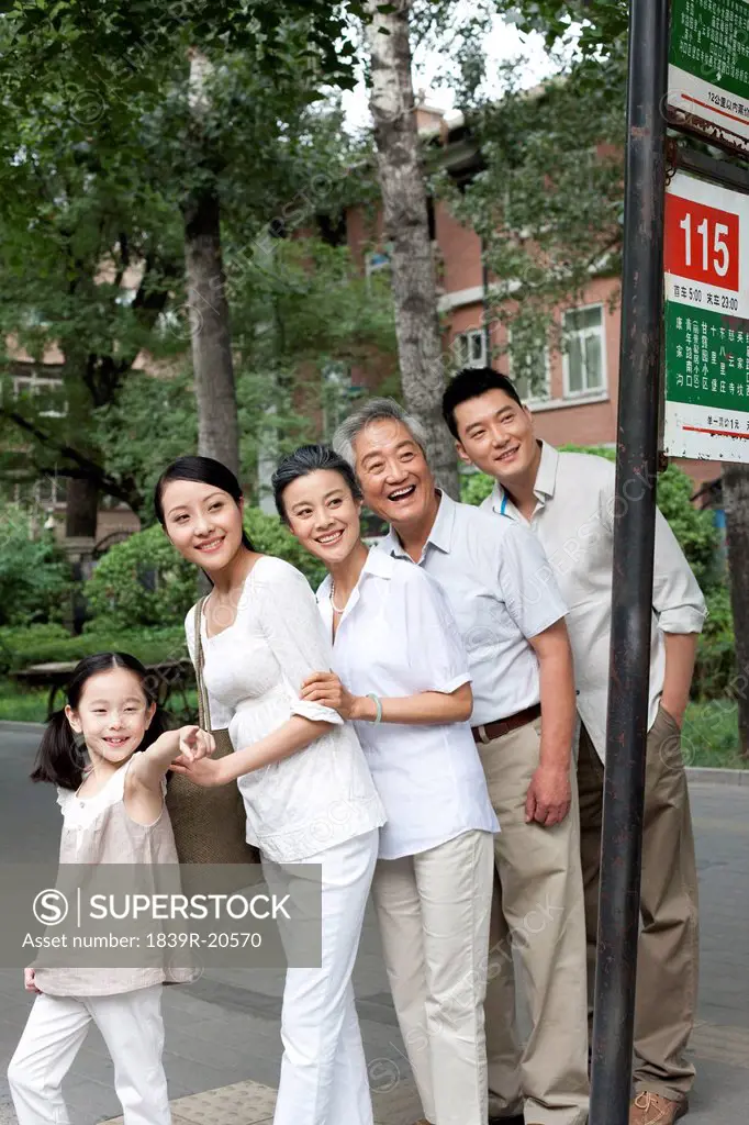 Chinese family at bus stop