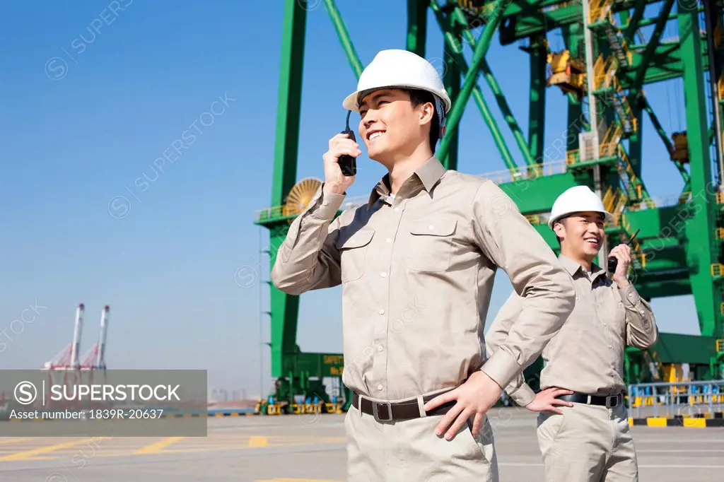 Male shipping industry worker with walkie_talkie