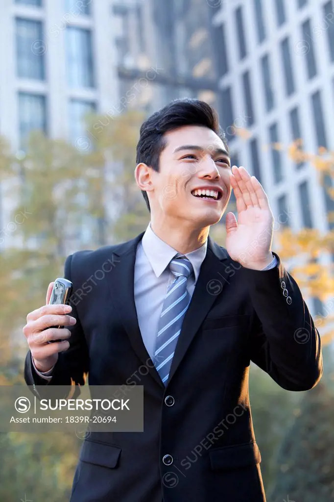 Businessman calling people outside