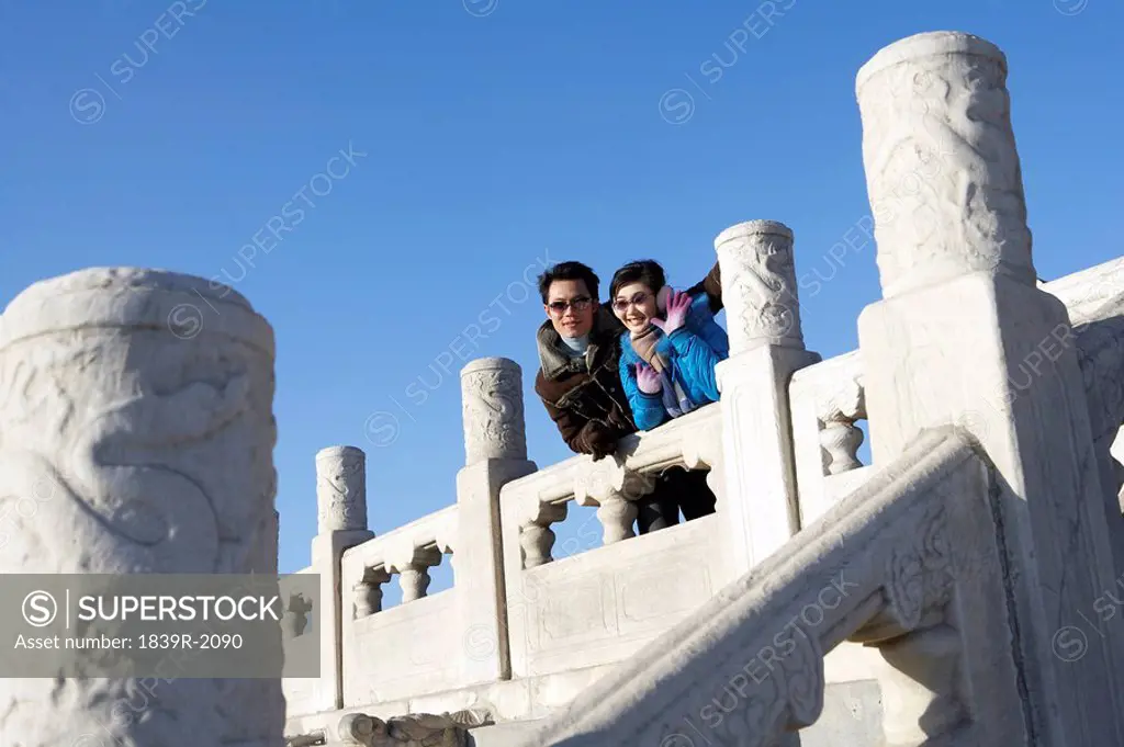 Couple In The Temple of Heaven, Beijing, China, Woman Waving