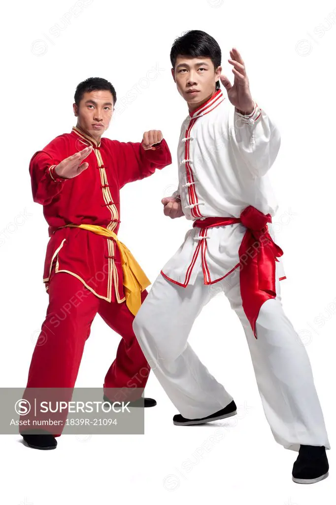 Two Men Doing Martial Arts in Traditional Chinese Clothing