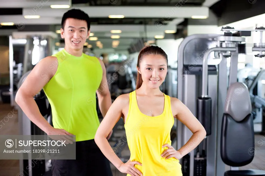 Young Man and Woman Together At Gym