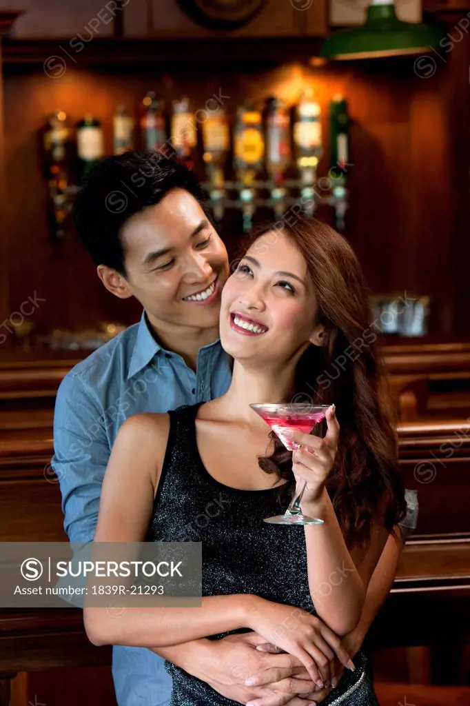 Couple Enjoying Cocktails Together
