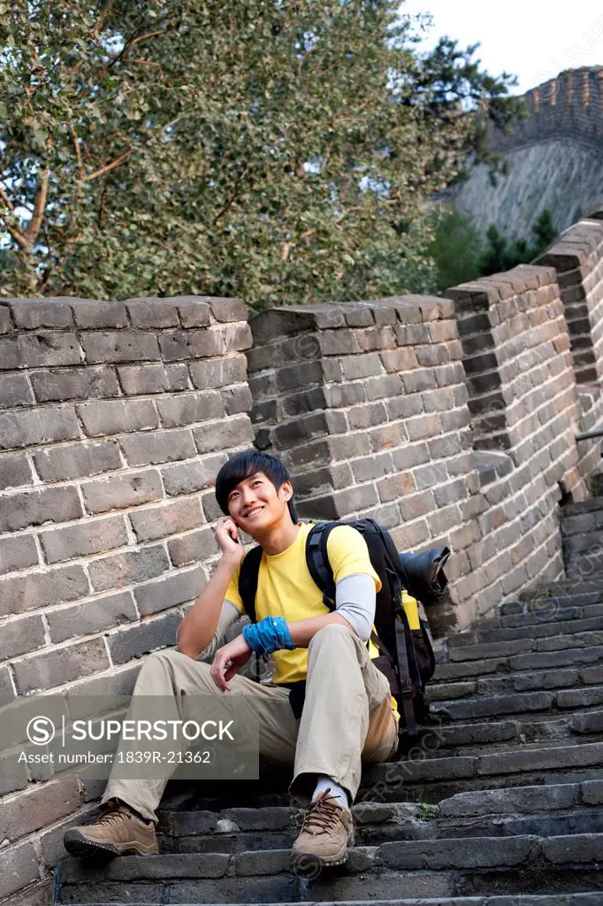 Young people using cellphone on the Great Wall