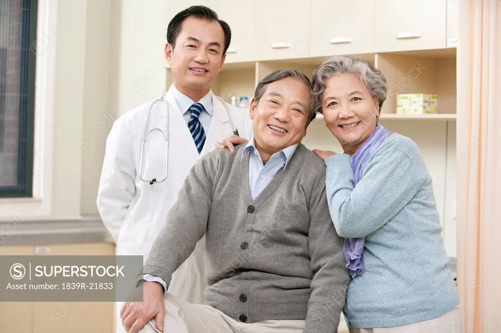 Senior Couple in an Examination Room with a Doctor