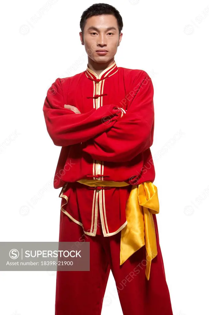 Focused Man Doing Martial Arts in Chinese Clothing