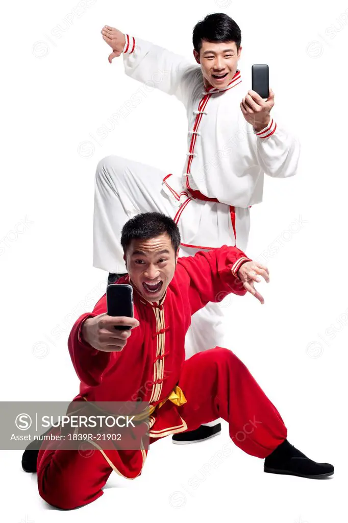 Men Doing Martial Arts and Looking at Mobile Phone