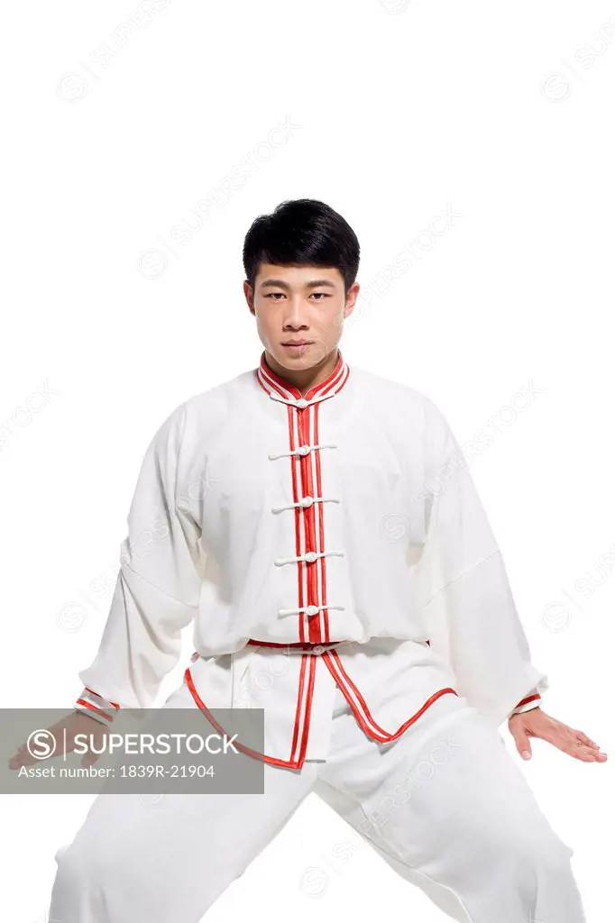 Man in Traditional Chinese Clothing Doing Taijiquan
