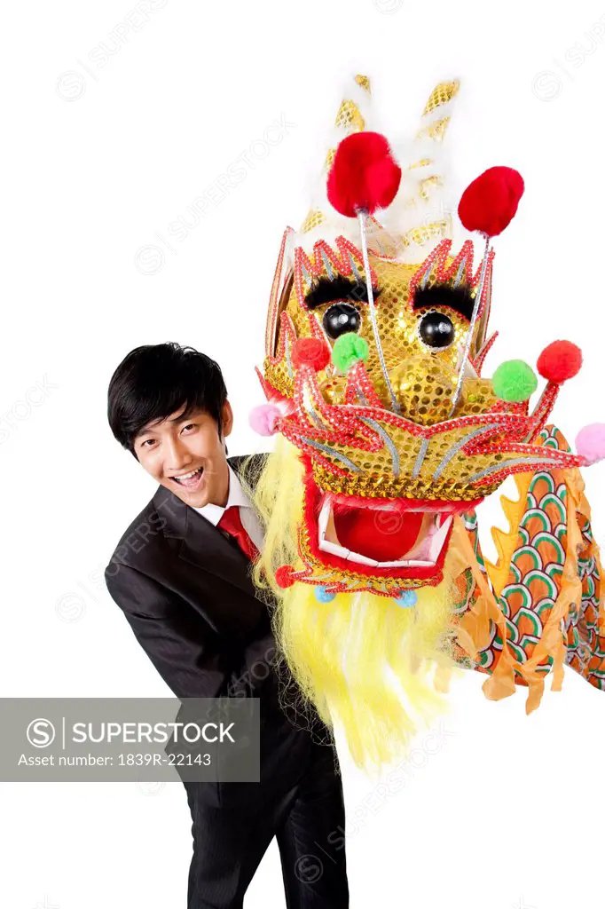 Businessman practising Chinese dragon dancing