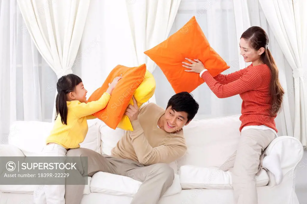 Family doing pillow fighting