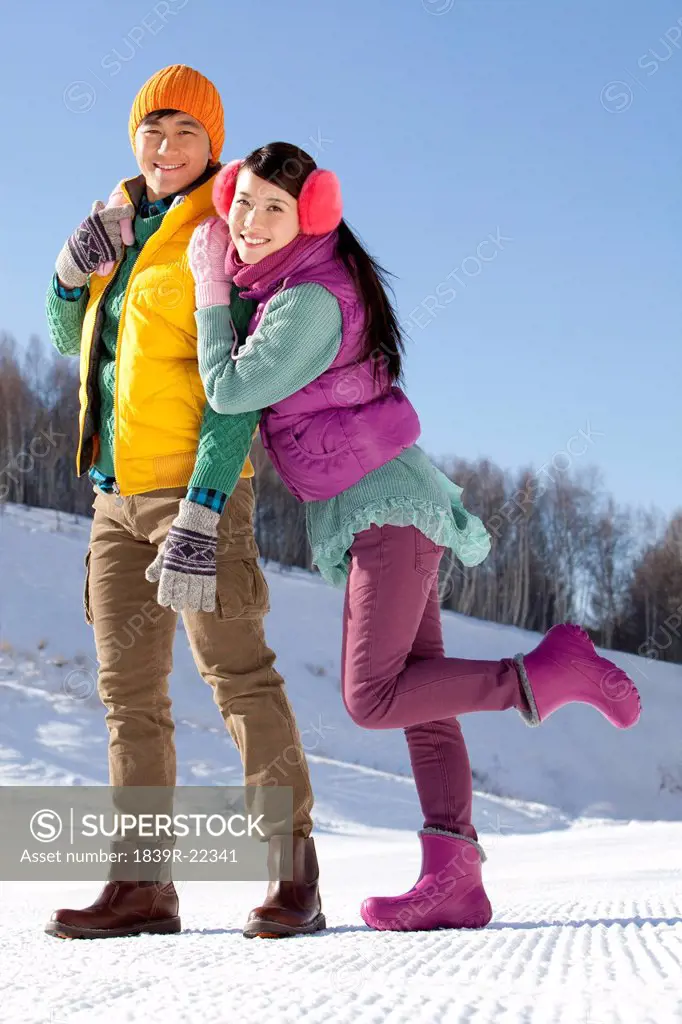 Happy young couple in ski resort