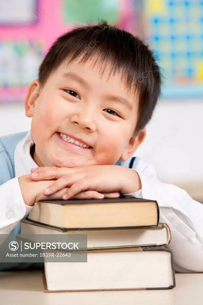 Young boy smiling in the classroom