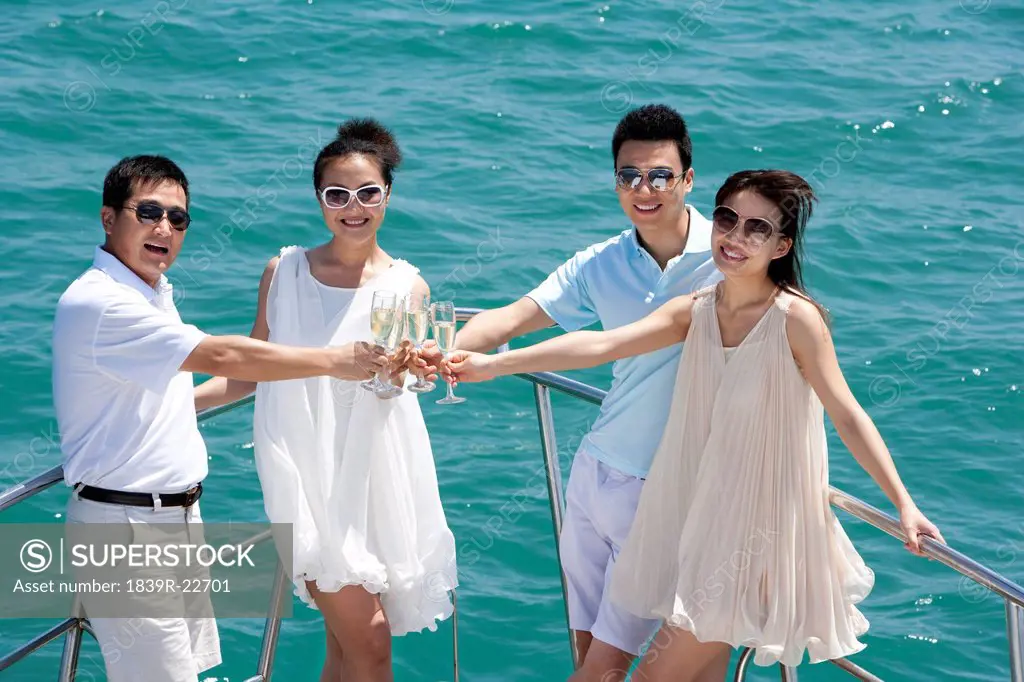 Friends Toasting Champagne on a Yacht