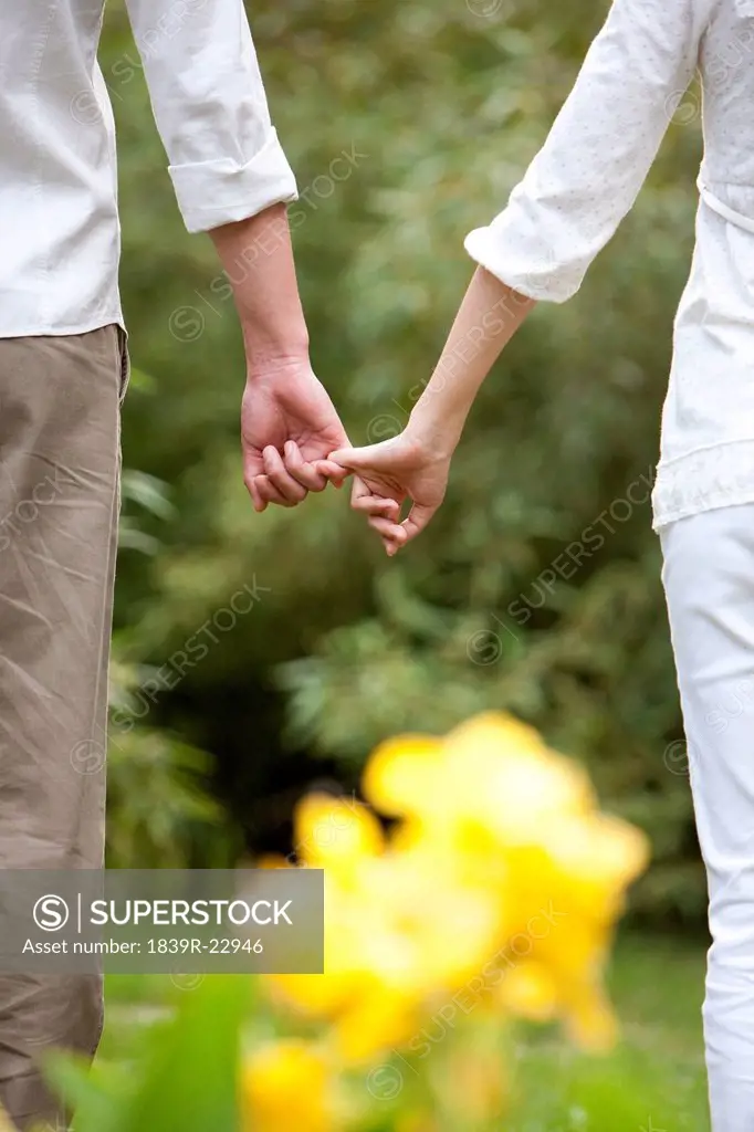 Young couple hand in hand