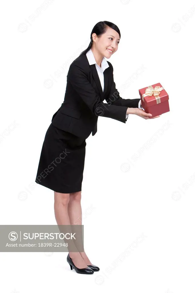 Happy Businesswoman Holding a Gift
