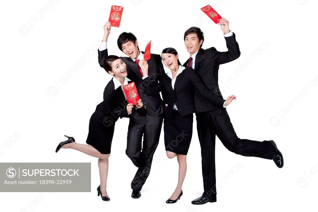 Business Colleagues Holding Up Red Envelopes