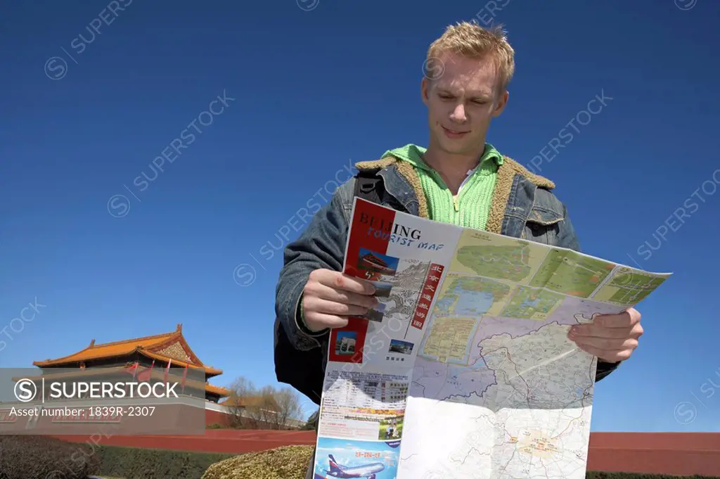 Young Man Looking At Map