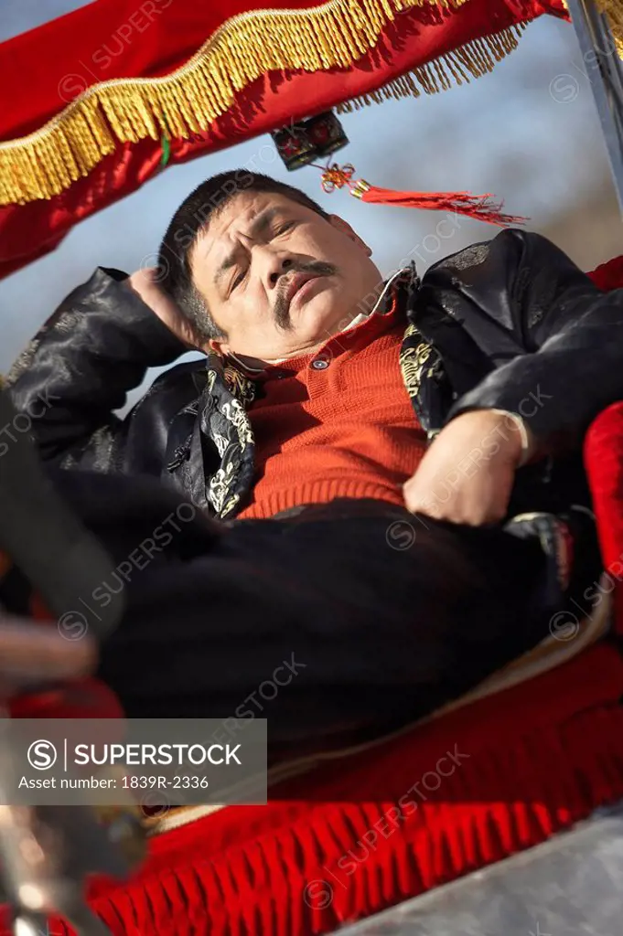 Man Sitting In A Tuk Tuk In The Forbidden City